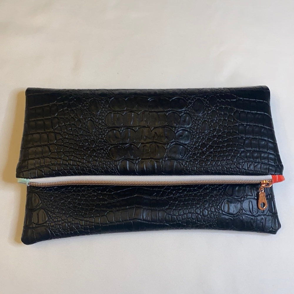 Embossed vegan leather foldover clutch